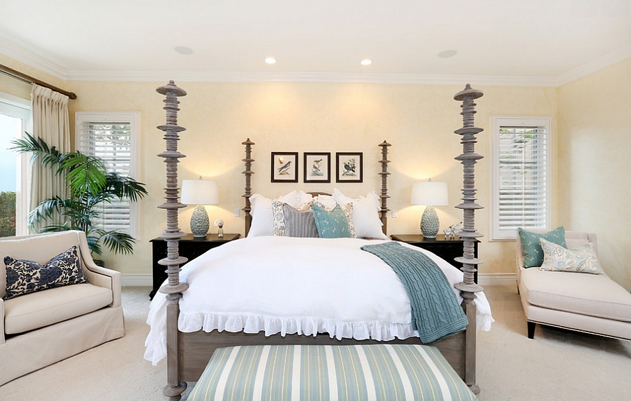 Accent additions bring pops of blue to the beach style bedroom