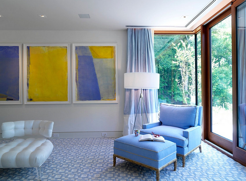 Artwork brings bright yellow into this luxurious bedroom