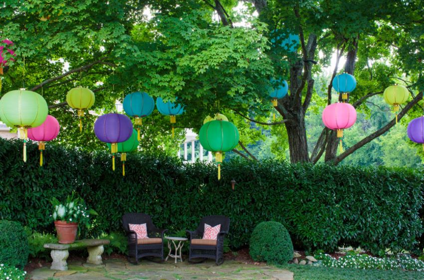 A festive backyard with hanging lanterns