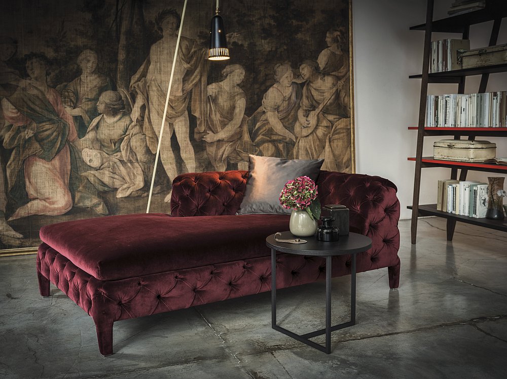 Beautiful chaise lounge in velvet red exudes opulence