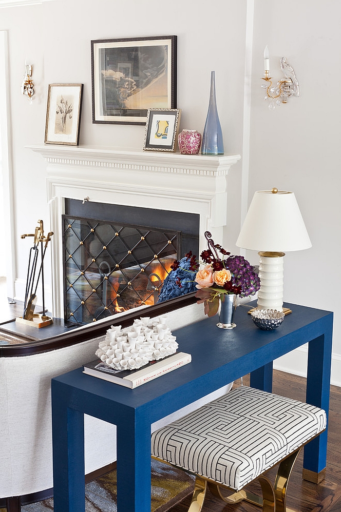 Blue console table and golden accents in the family room