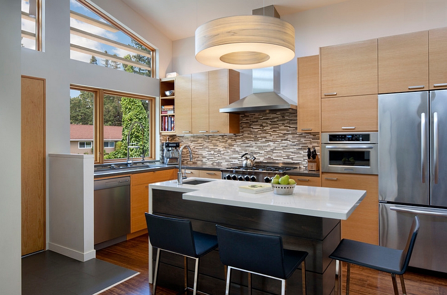 Countertop overhangs give additional counter space without taking up foot room [Design: Ana Williamson Architect]