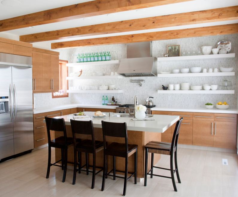 Dishes, drinks and artwork on open shelving in a modern kitchen