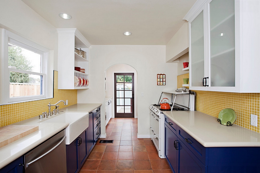 Eclectic kitchen with blue cabinets and yellow tile backsplash [Design: Caisson Studios]