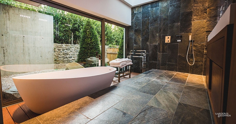 Exclusive spa-styled bathroom design with a large standalone bathtub