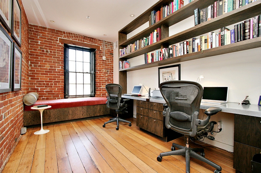 Exposed brick walls and industrial windows in the home office