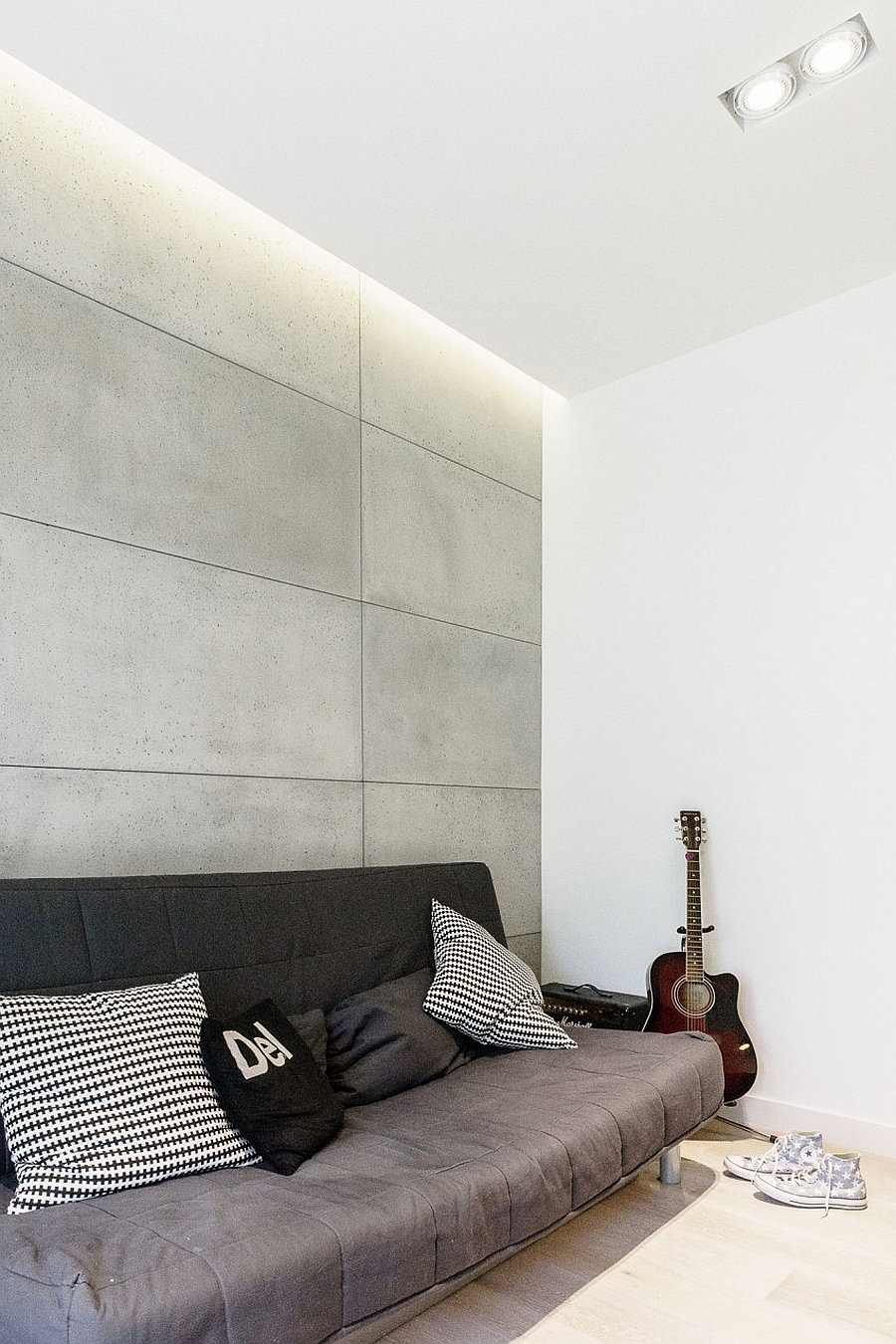 Exposed concrete wall brings contrasting texture indoors