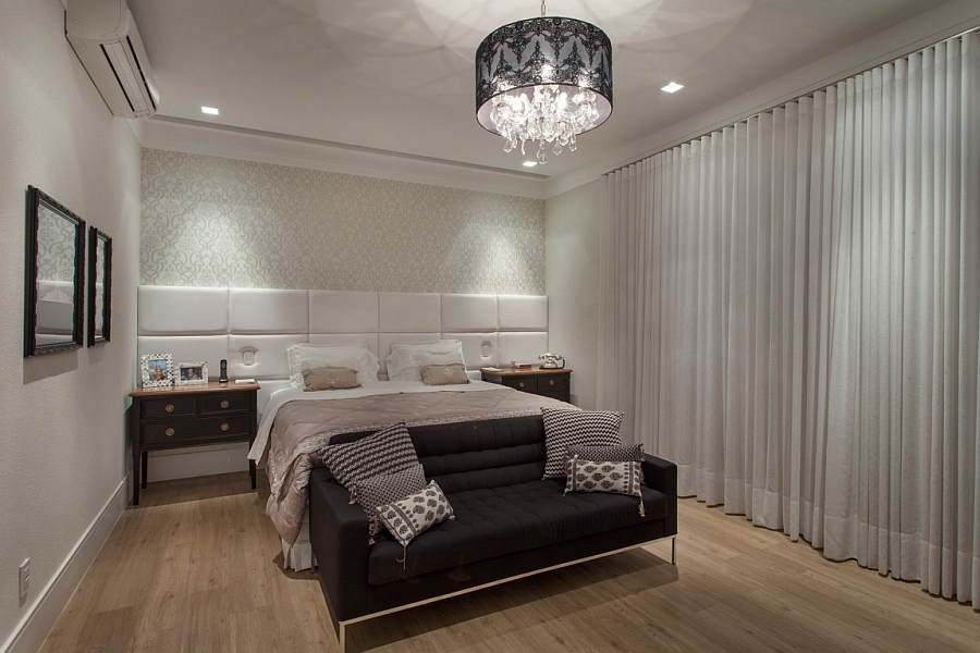 Exquisite master bedroom with a half-tufted wall behind the heardboard