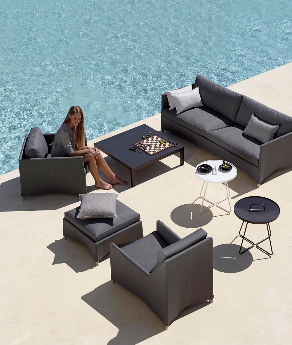 Fashionable outdoor chairs and couch in trendy grey