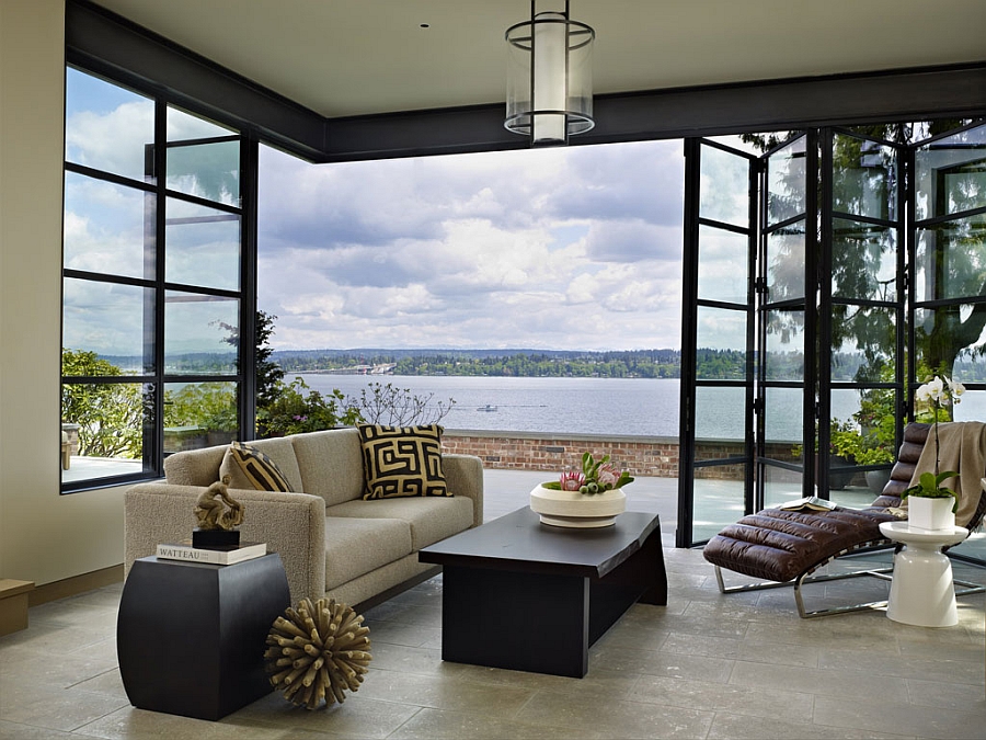 Floor-to-ceiling floding glass doors with stainless steel frame