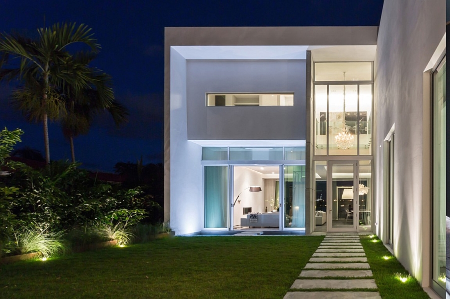 Gorgeous lighting takes over the posh beach house after sunset