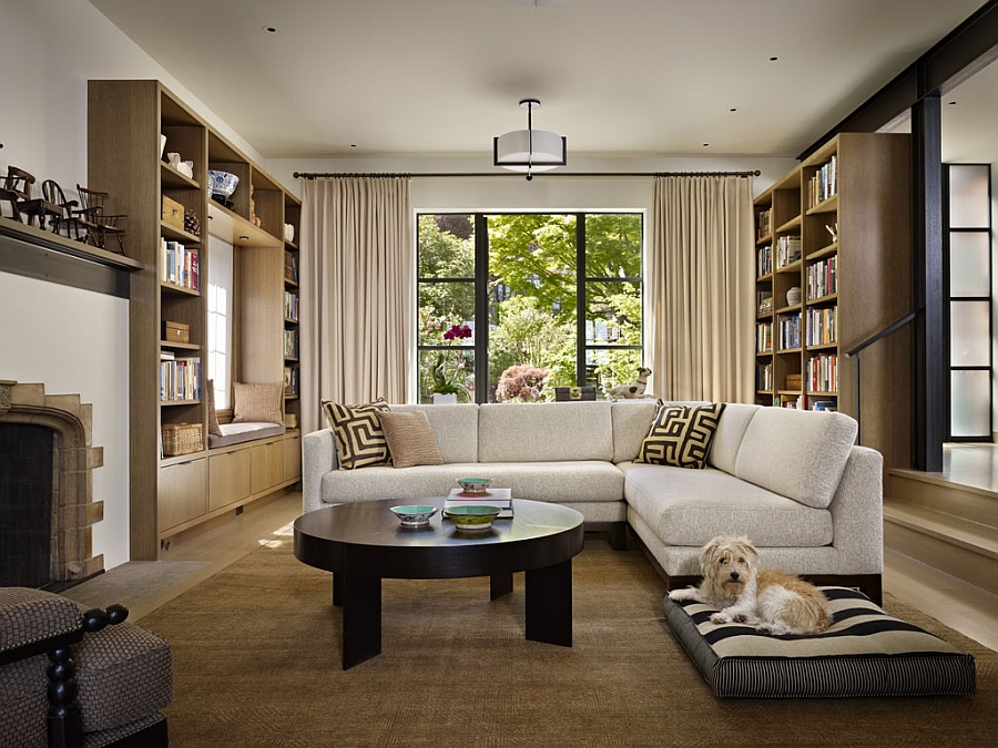 Large couch in white and bookshelves define the cool living room