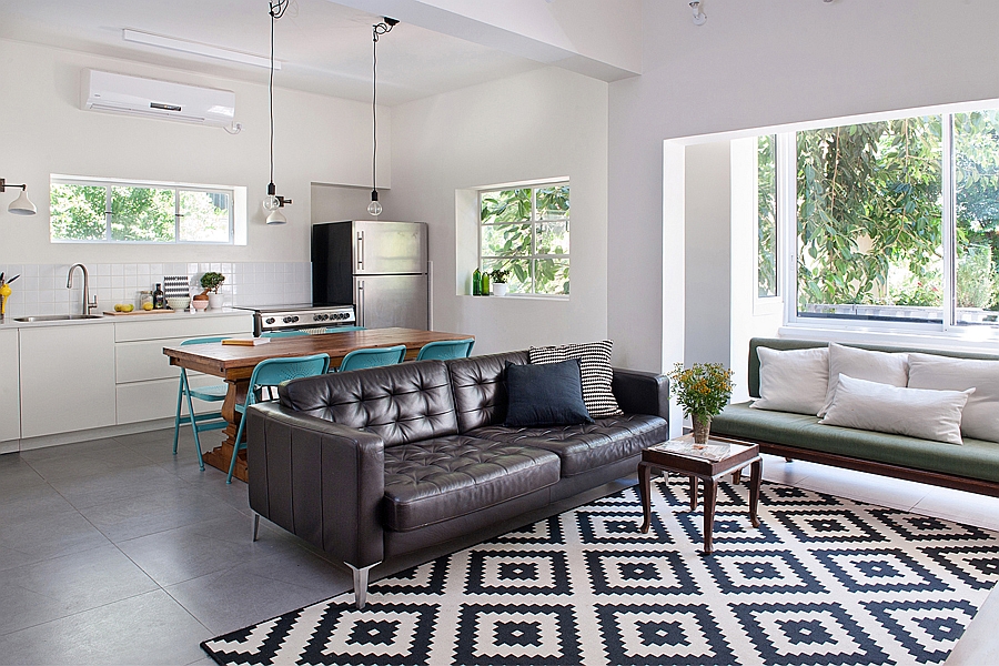 Living room of the renovated apartment embraces a white backdrop