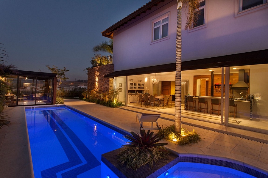 Pool area and outdoor lounge after sunset