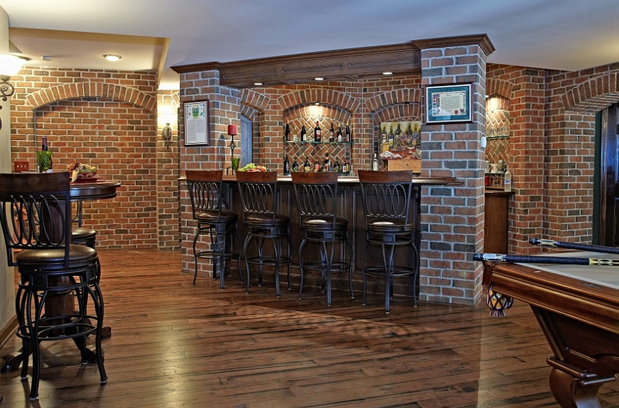 Pub style basement bar with a beautiful brick backdrop [Design: M.J. Whelan Construction]