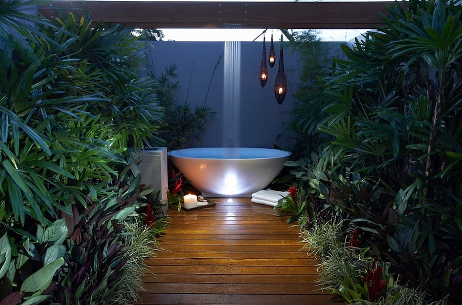 Rain shower above the outdoor bathtub in the patio! [Design: Dean Herald-Rolling Stone Landscapes]