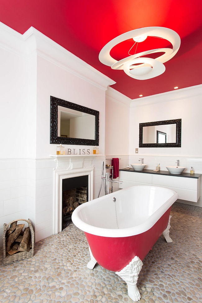 Red ceiling and the claw-foot bathtub stand out with ease