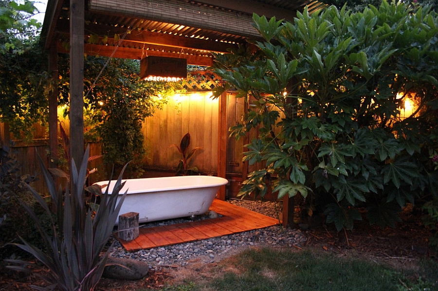 Salvaged bathtub at the heart of a lovely backyard spa!