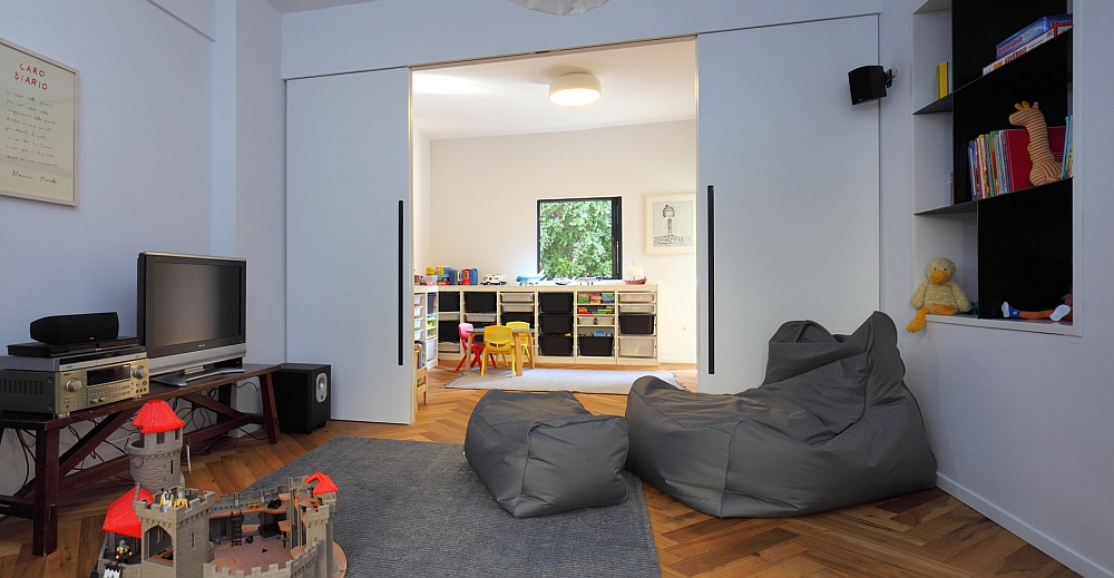 Simple family room that is connected with the children's playroom