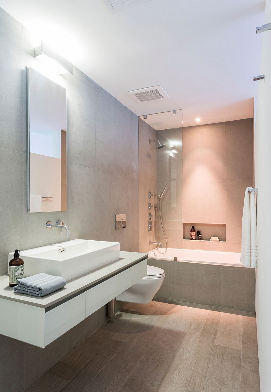 Small shower area and bathroom design in gray and white