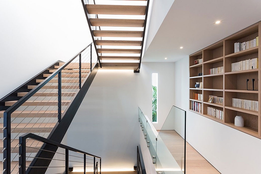 Staircase in steel and wood connects the different levels of the posh beach house