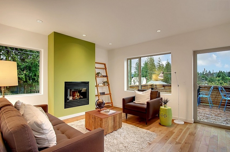 Stylish living room with a green accent wall [Design: LimeLite Development]