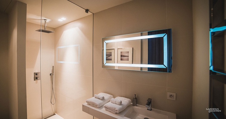 Stylish modern bathroom with glass shower area