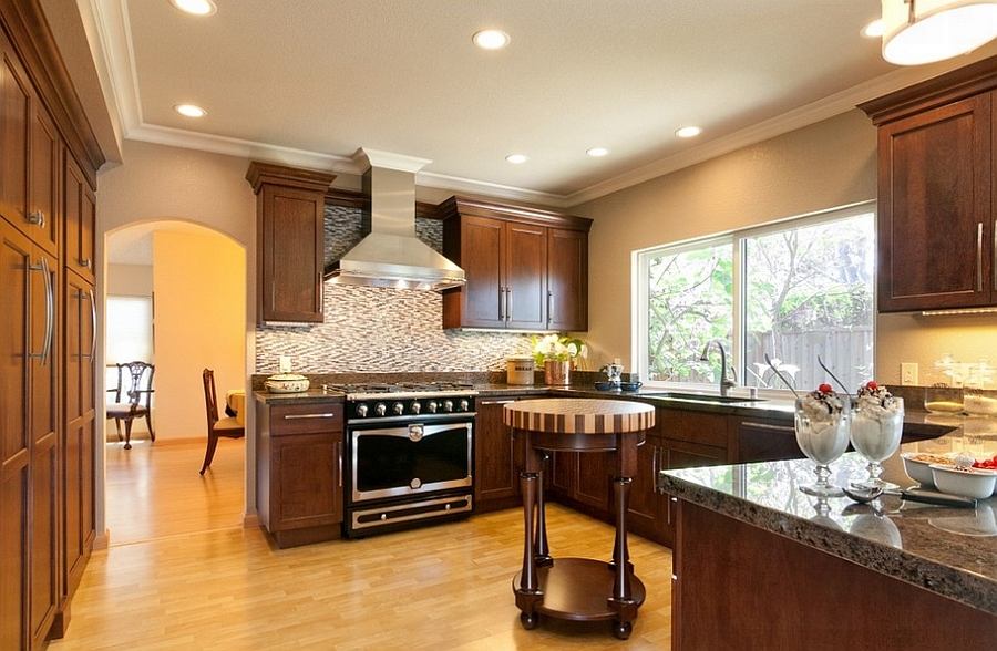 Petite , round kitchen island with a butcher block top [Design: RemodelWest]