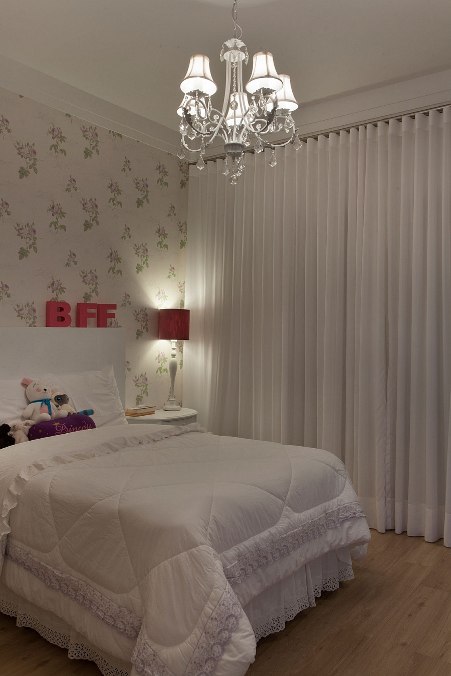 White drapes give the bedroom a soft appeal