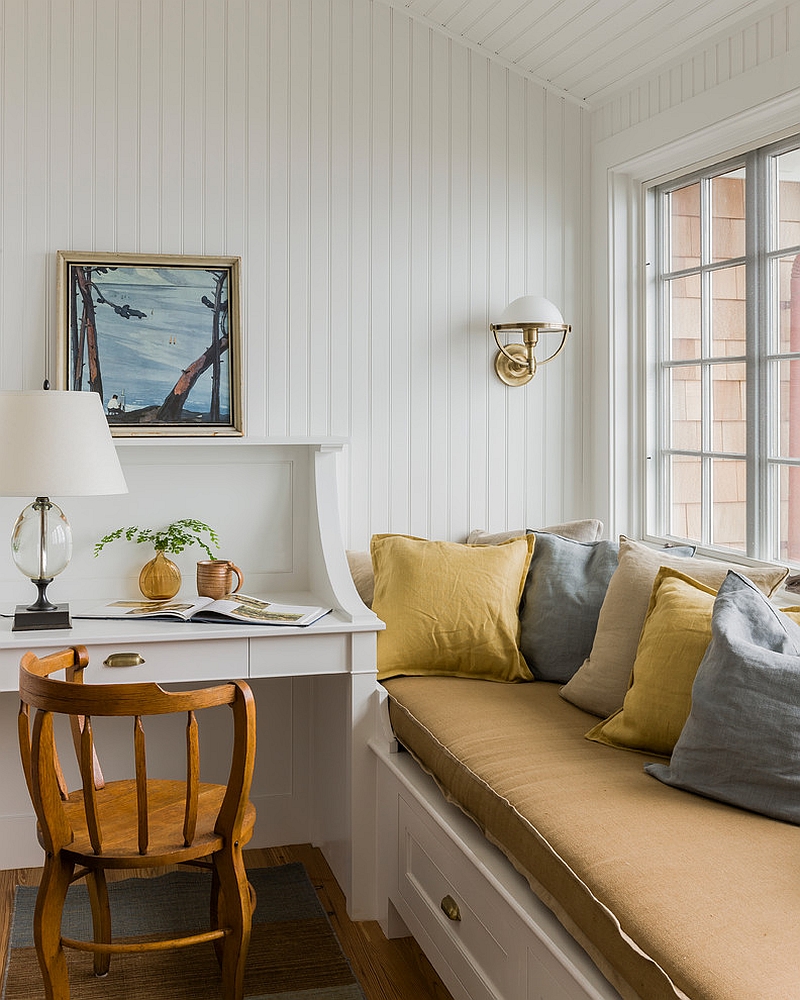 A relaxing window seat adds to the ambiance of the small home office