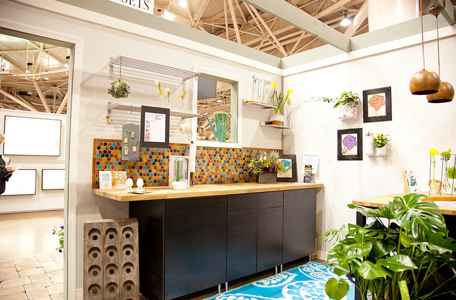 Bold multi-color penny tiles create a vivacious backdrop for the eclectic kitchen