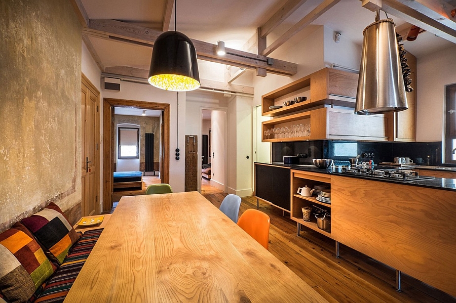 Bold pendant in black adds sophistication to the dining space