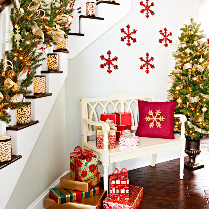 Bold snowflakes in red on the wall add to the staircase decorations