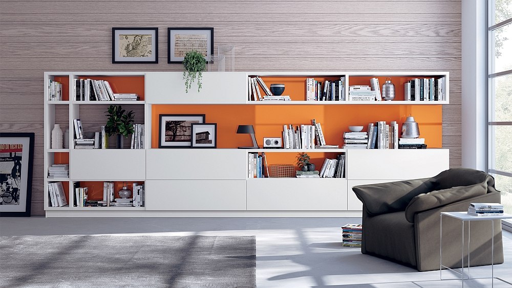 Brilliant splashes of orange enliven the neutral living room