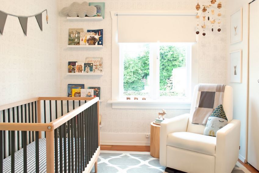 Caravan crib in a modern nursery