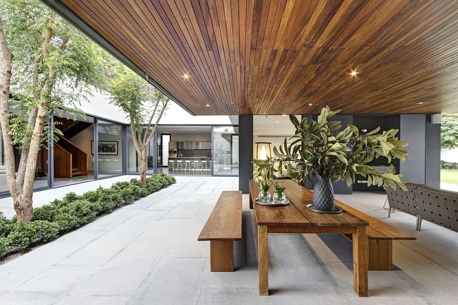 Central courtyard of the residence with an outdoor dining space