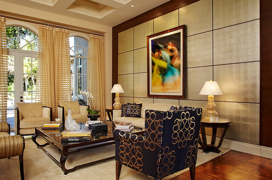 Chair, throw pillows and table lamps bring pops of gold to the room [Design: Arnold Schulman Design Group]