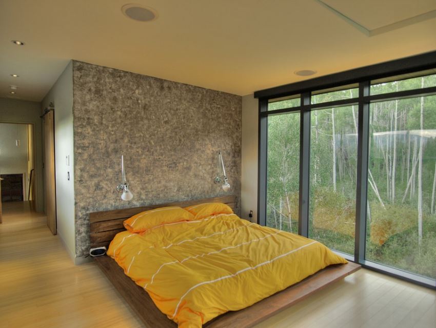 Contemporary bedroom with a forest view