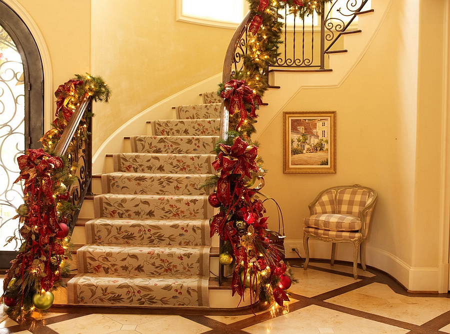 Custom holiday decorations for the staircase in gold and red [Design: Regina Gust Designs]