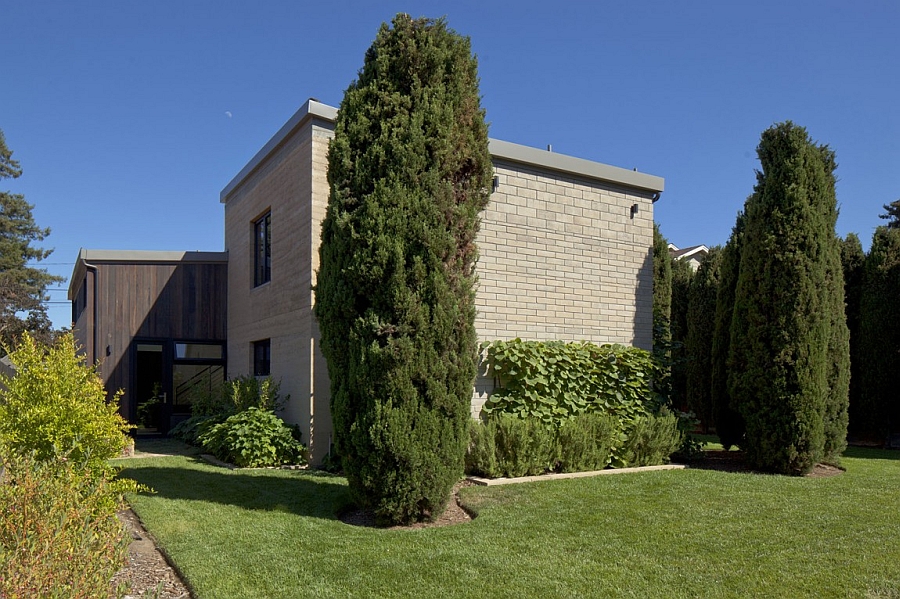 Cypress trees add to the beauty of the natural landscape around the expansive home