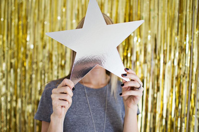 DIY fringe curtain photo backdrop from A Beautiful Mess