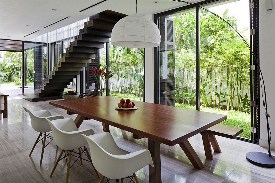 Eames chairs and oversized floor lamp at the dining table