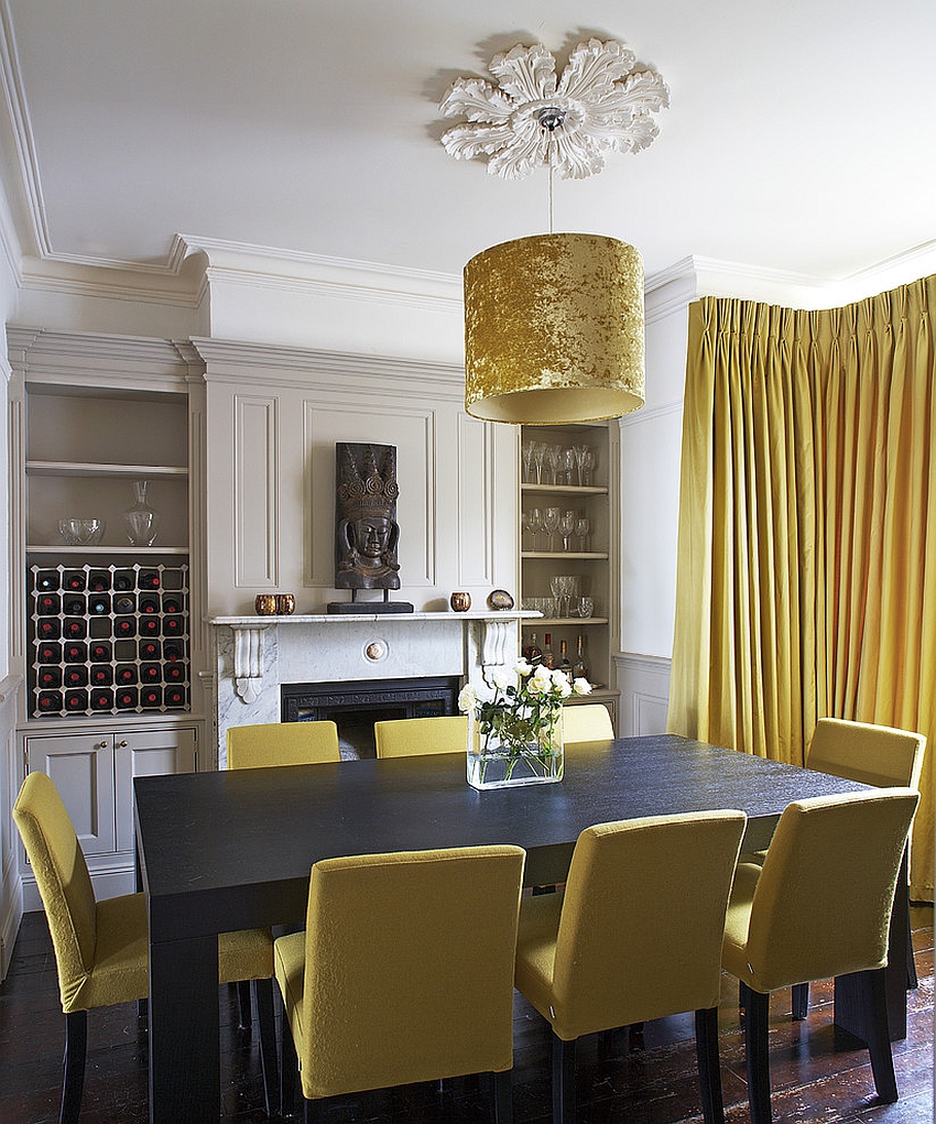 Exclusive drum pendant adds golden glint to the dining room