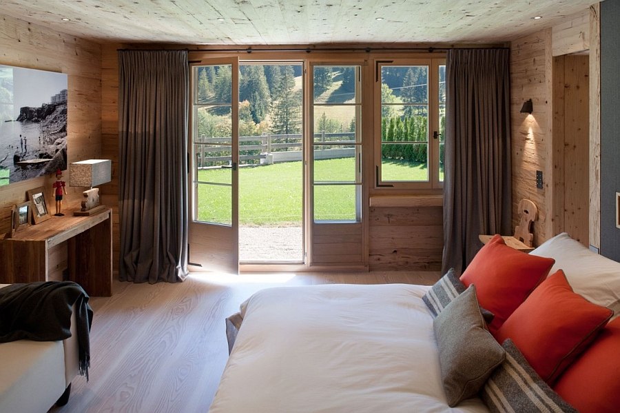 Fabulous chalet bedroom opens up towards the private backyard outside