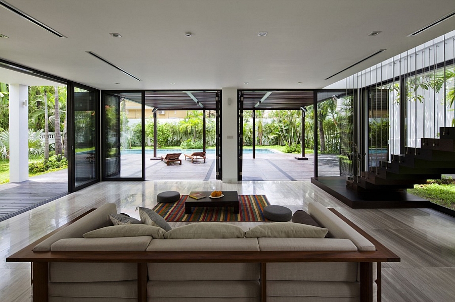 Gorgeous living area design opening towards the pool and backyard