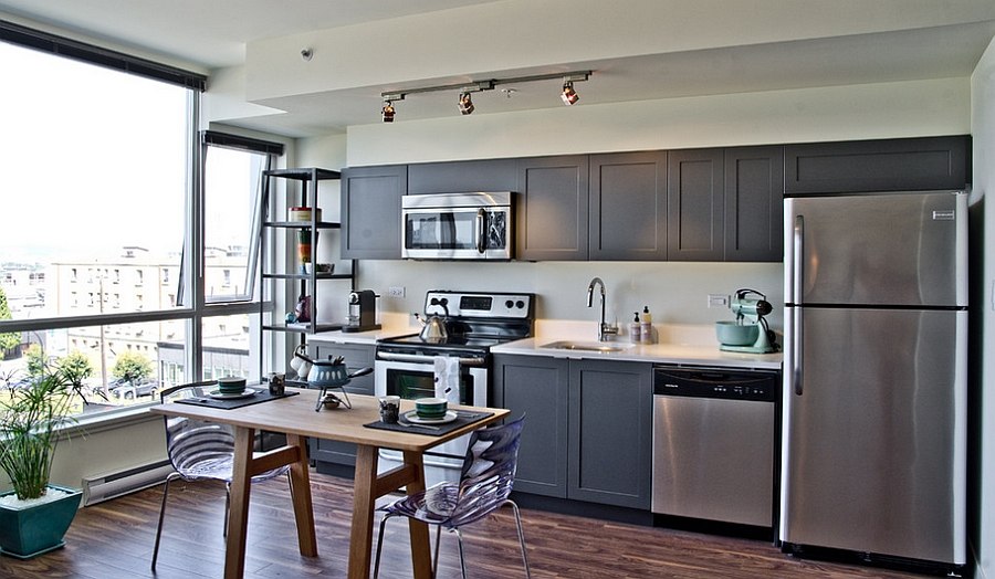 Gray adds modernity to the Shaker-style kitchen cabinets [Design: Mango Design Co.]