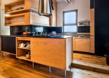 Kitchen-design-that-embraces-wooden-warmth-along-with-black-217x155