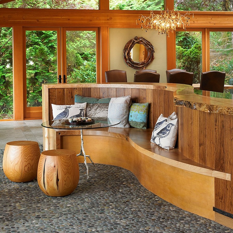 Kitchen island extends to shape a built-in banquette