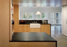 Kitchen-with-polished-concrete-floors-and-warm-wooden-elements-217x155