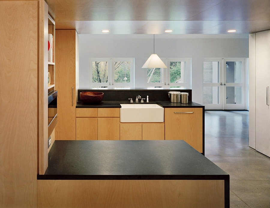 Kitchen with polished concrete floors and warm wooden elements